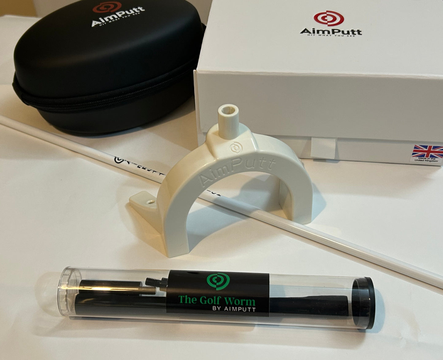 The Aimputt Trainer and The Golf Worm package.