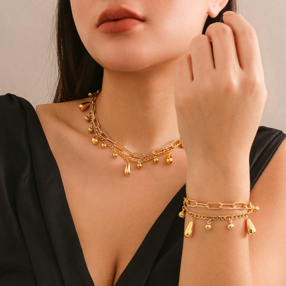 Glossy Comma Pendant Necklace & Bracelet