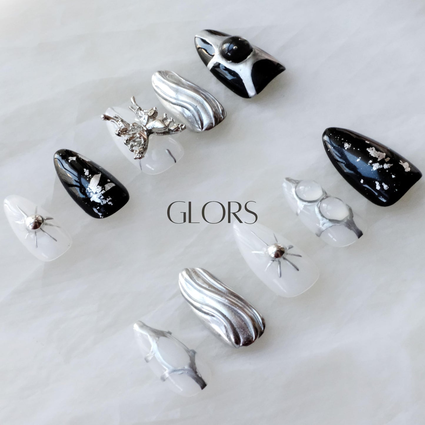 GLORS Gothic Long Almond Press-On Nails – Black & Silver with Butterfly Accent