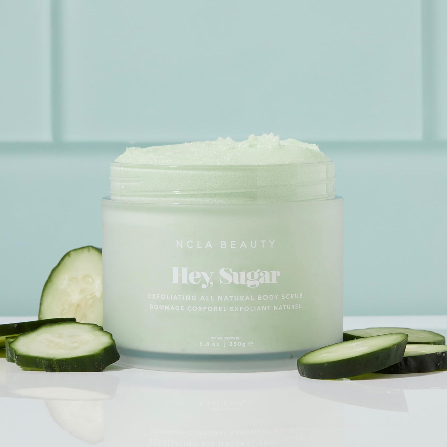 NCLA BEAUTY Hey Sugar All Natural Body Scrub – Moisturizing Exfoliating Sugar Scrub with Mango, Shea & Cocoa Butter, Cucumber – 8.8 oz