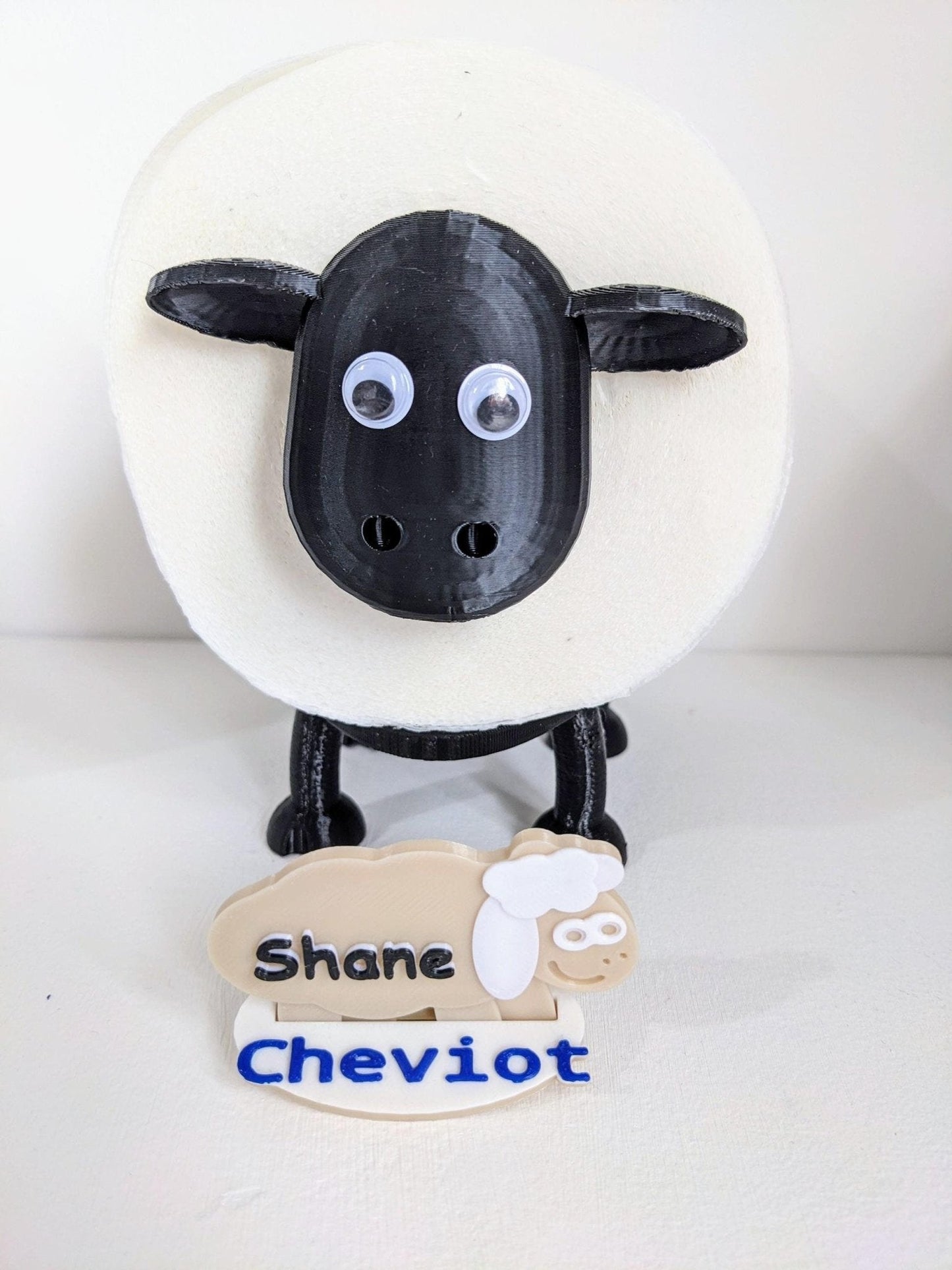 Universal fitting black sheep spare toilet roll holder .