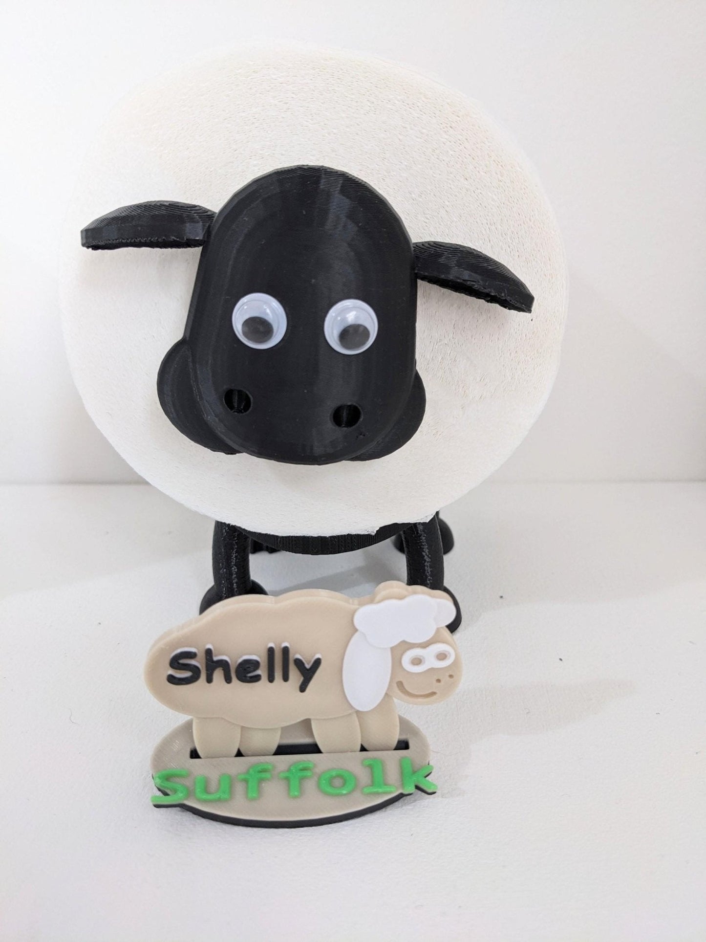 Universal fitting black sheep spare toilet roll holder .