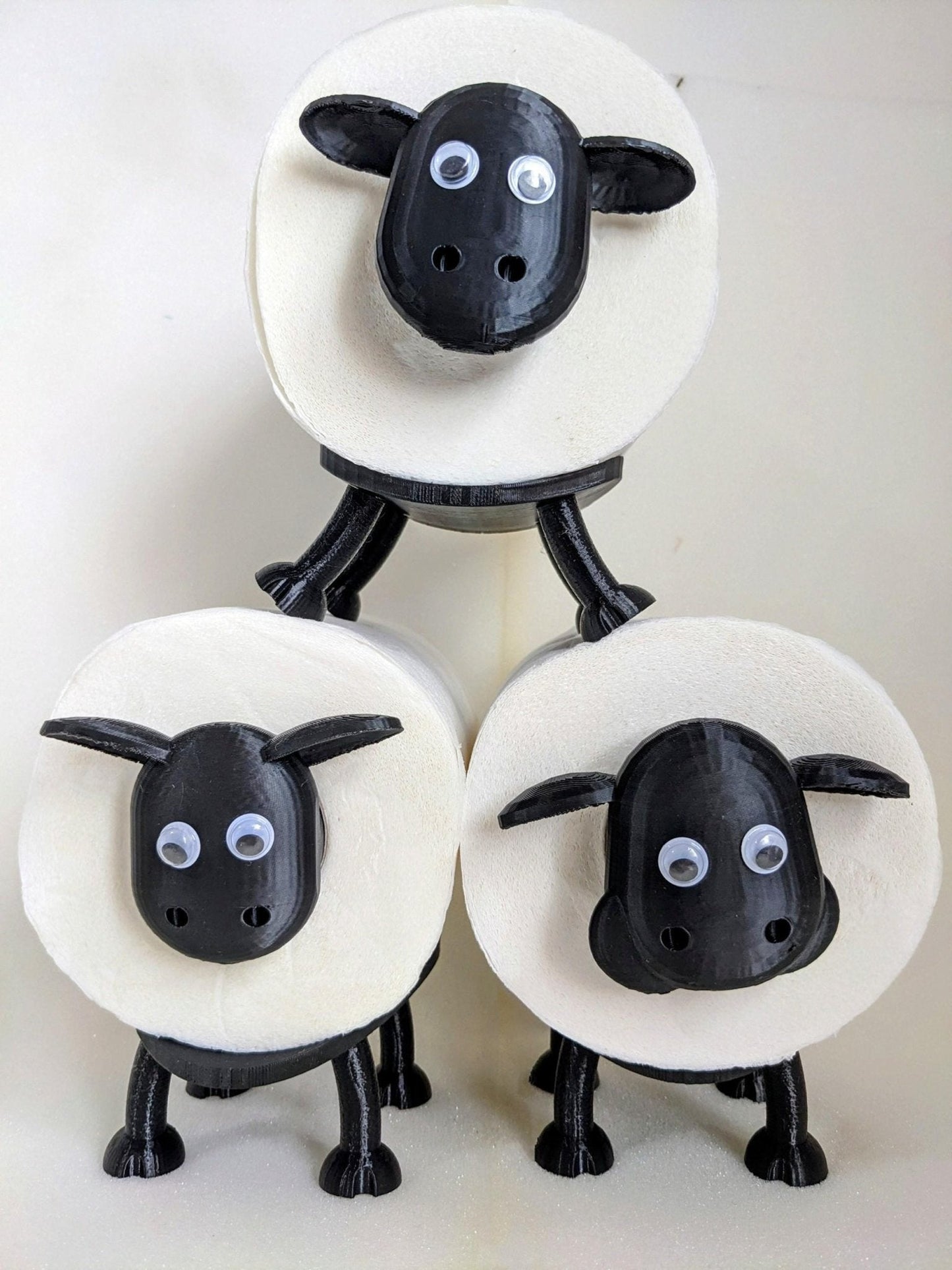 Universal fitting black sheep spare toilet roll holder .