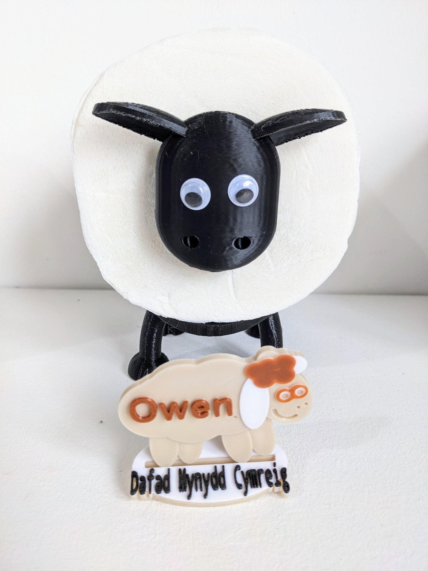 Universal fitting black sheep spare toilet roll holder .